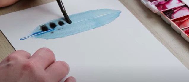 Adding patterns to feathers using watercolour
